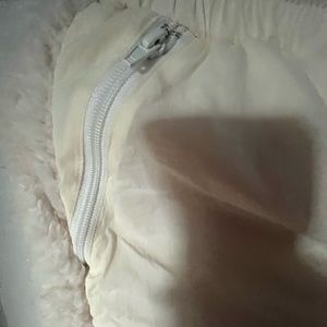 Small size pants with zipper pockets. Material is polyester and cotton.